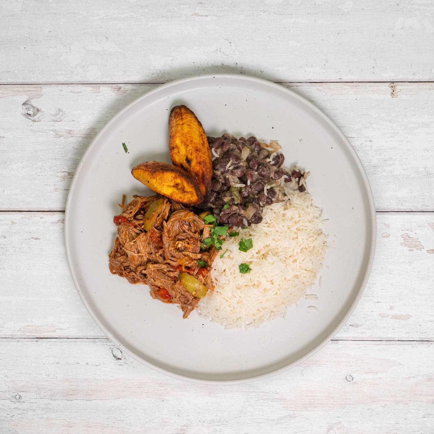 Ropa Vieja with Rice, Beans, and Fried Plantain